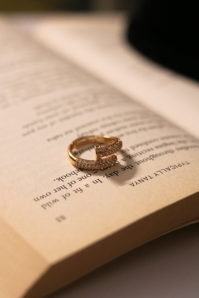 A gold ring of timeless elegance, adorned with dazzling stones